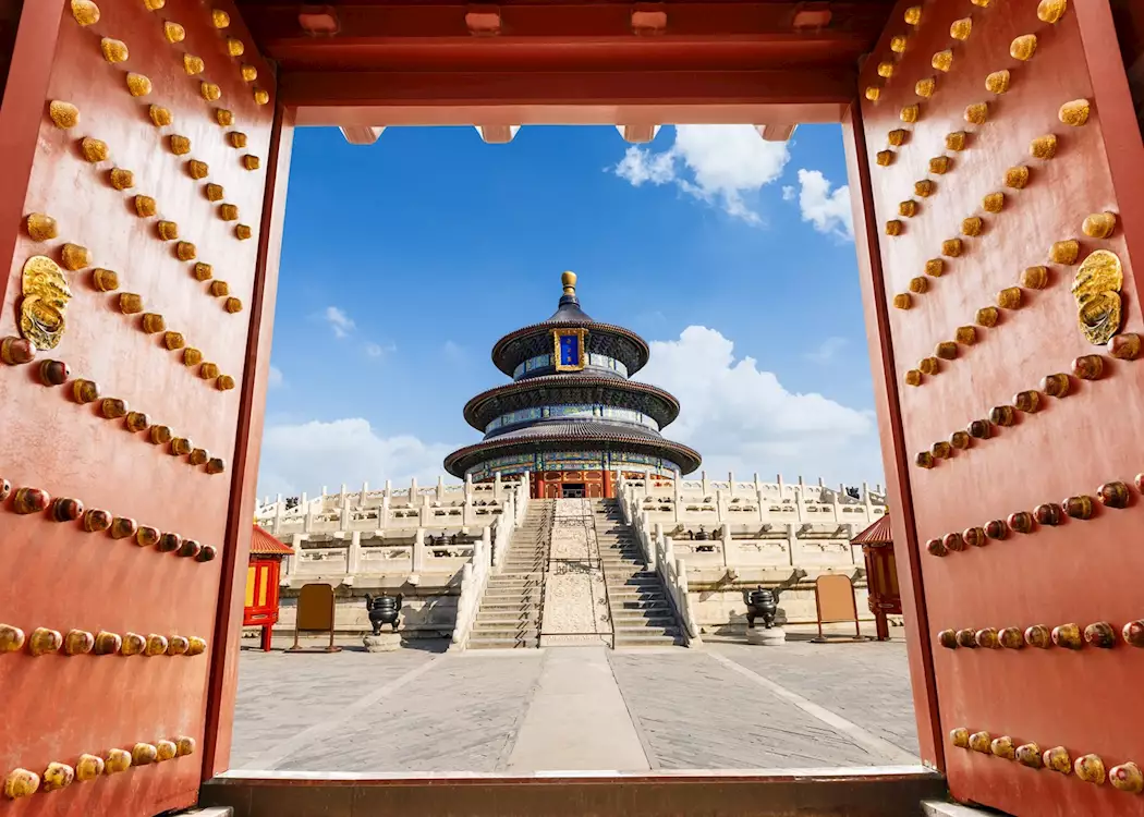 Temple of Heaven framed by traditional red doors