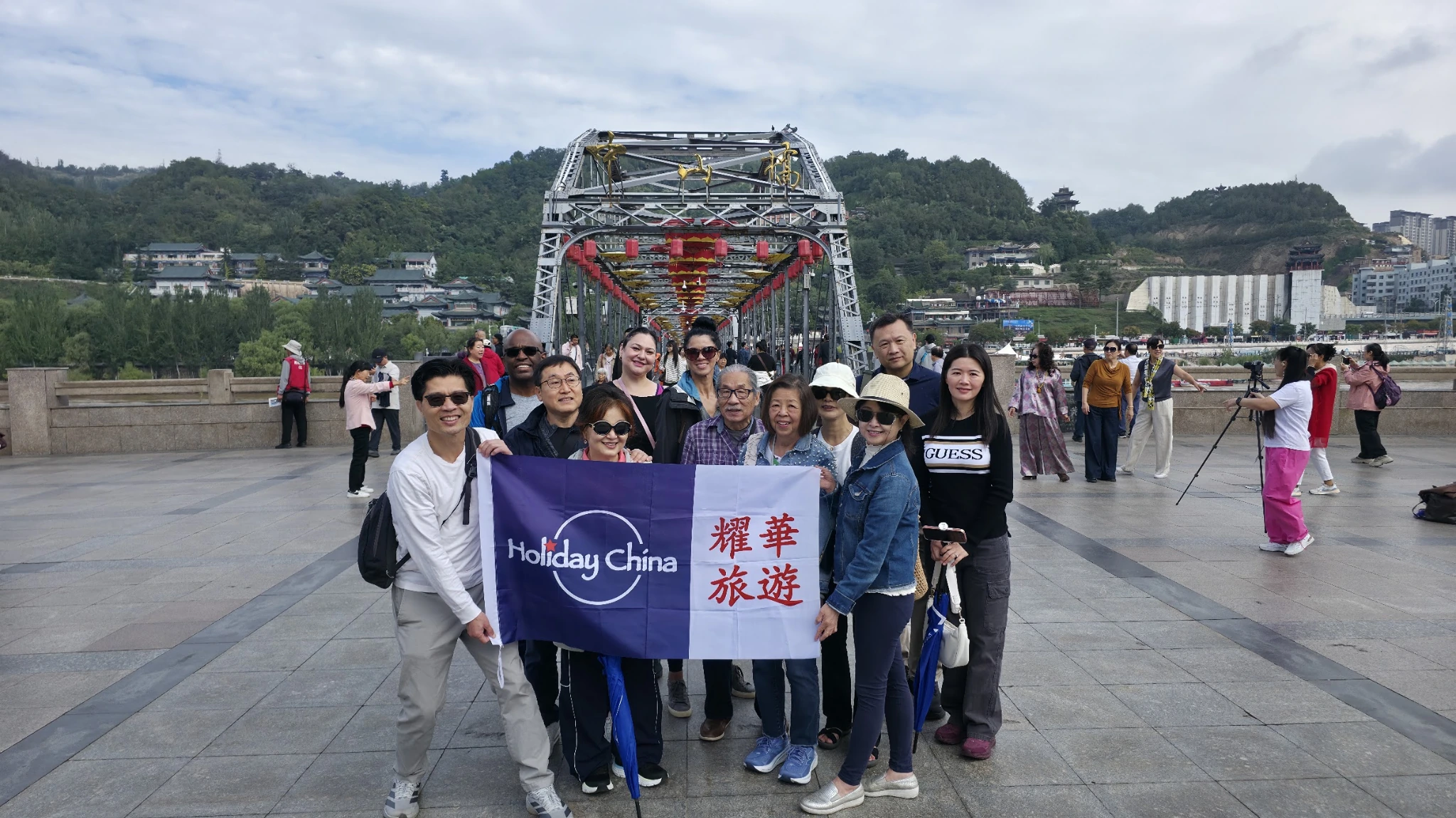 Holiday China travel group at Zhongshan Bridge in Lanzhou